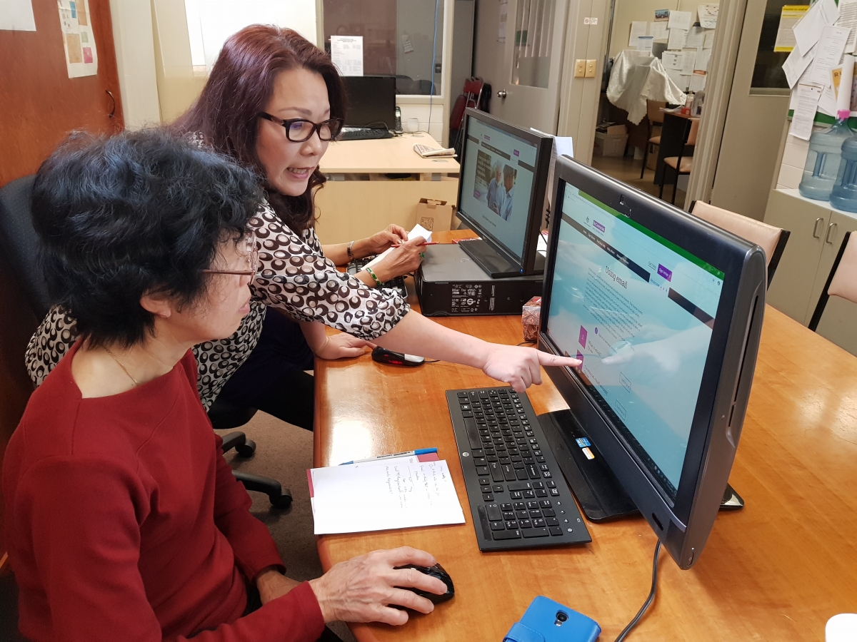 Ly teaches someone on the Be Connected Learning Portal.